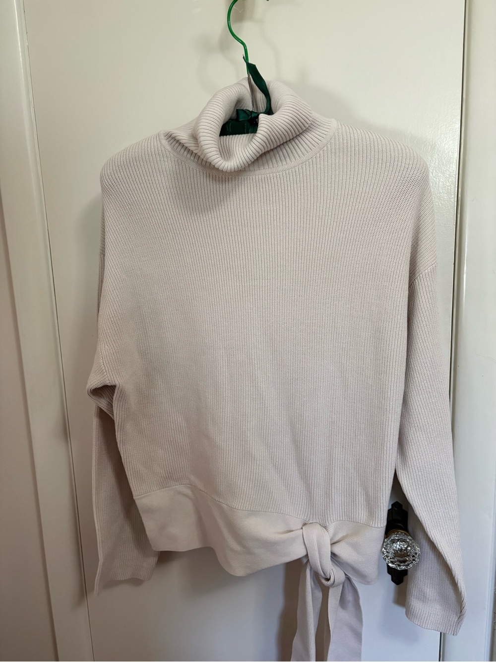 White dress turtleneck with tie at hips